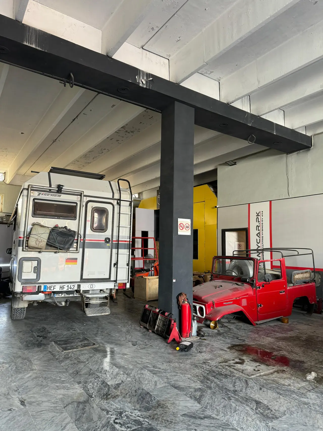 overlander from germany to nepal relaxing at fixmycar garage